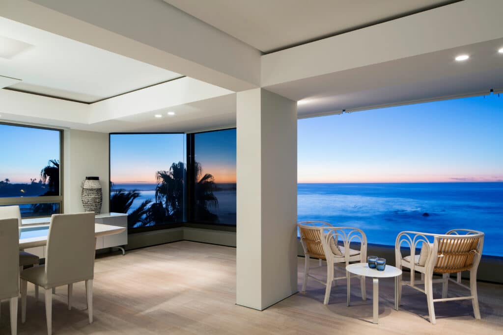 Ocean view , white wooden lounge chairs, wooden flooring